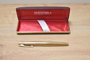 A Sheaffer Stylist push button converter fill fountain pen in 12K gold fill having Sheaffer 14K made