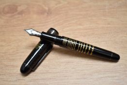 A boxed Platinum 3776 Star Wars converter fill fountain pen in black with white stars having a Use