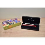 A boxed Delta Europa 20th Anniversary converter/cartridge fill fountain pen in red marble with two