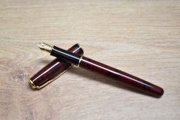 A boxed Parker Sonnet converter fill fountain pen in red lacque having a Parker 18k 750 nib