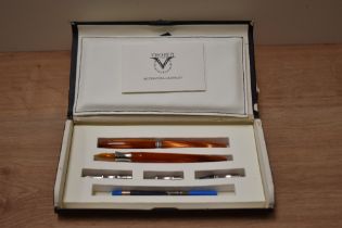 A Visconti Art of Writing Calligraphy boxed set in orange.