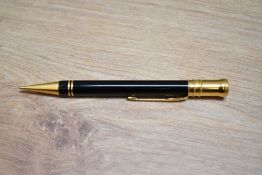 A boxed Parker Duofold International propelling pencil in black with gold trim