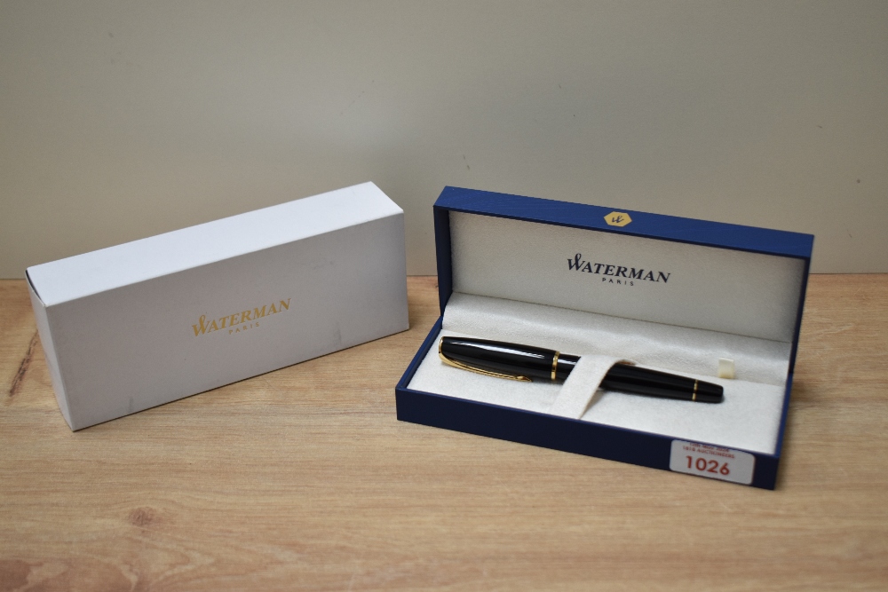 A boxed Waterman Charleston converter fill fountain pen in ebony black with gold trim having