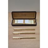 A boxed Parker 95 Insignia converter fill fountain pen, rollerball and ballpoint pen set in rolled