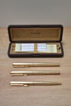 A boxed Parker 95 Insignia converter fill fountain pen, rollerball and ballpoint pen set in rolled