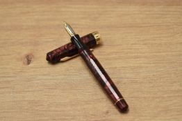 A Wahl Eversharp Doric (2nd Gen) piston fill fountain pen in burgundy and black marble having