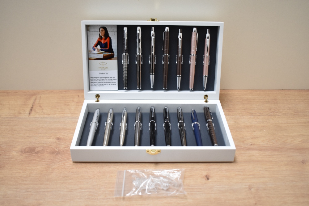 A Parker Collectors box complete with sixteen Parker IM pens featuring a brushed steel fountain
