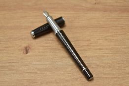 A Parker Urban Premium converter fill fountain pen in ebony with gold trim having a Parker nib.