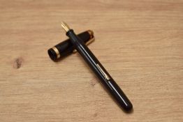 A Waterman 502 lever fill fountain pen in dark burgundy having Waterman 14ct W-2A nib.