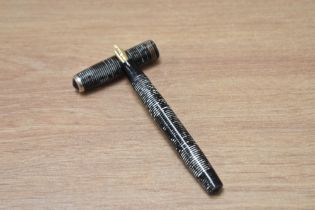 A Parker Vacumatic Standard fountain pen in silver pearl with three narrow bands to the cap having