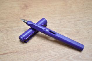 A Lamy Safari cartridge fill fountain pen in violet having Lamy EF nib.