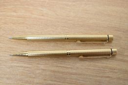 Two Sheaffer Targa 1009 ballpoint pens gold filled in barleycorn pattern