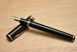 A Sheaffer Connaisseur 810 converter fill fountain pen in black with gold trim having Sheaffer 18K