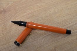 A Parker Big Red rollerball pen