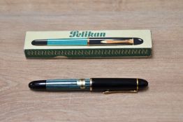 A boxed Pelikan 140 in green with instructions having Pelikan 14K 585 nib. As new still with Pelikan