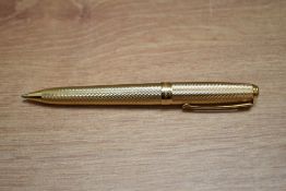 A boxed Sheaffer Prelude ballpoint pen in gold fill barleycorn pattern.