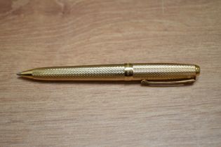 A boxed Sheaffer Prelude ballpoint pen in gold fill barleycorn pattern.