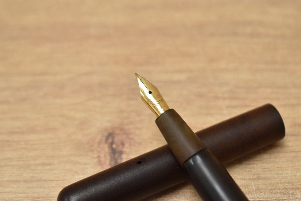A Conklin crescent fill fountain pen in BHR having Meteor F 18ct No.10 nib. Crack to base of cap. - Image 2 of 3