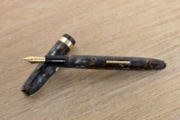 A Burnham B59 lever fill fountain pen in grey gold marble having Burnham 14CT gold Super Duliti nib