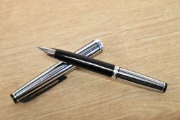 A Platinum Pocket cartridge fill fountain pen in stainless steel with black stripes having 18K-WG