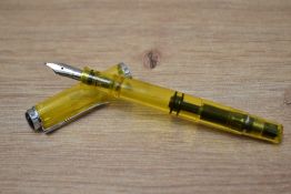 A Pelican M205 Duo Yellow Highlighter piston fill fountain pen having Pelikan B nib