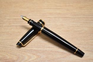 A boxed Waterman Expert II converter fill fountain pen in black with gold trim having Waterman