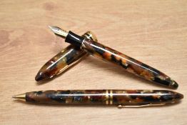 A boxed Sheaffer Balance II converter fill fountain pen and ballpoint pen set in amber glow with two