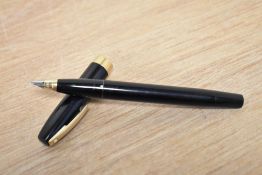 A Sheaffer Imperial Touchdown III plunger fill fountain pen in black with gold trim having