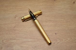 A boxed Sheaffer Targa 1013 converter fill gold plated fountain pen with spiral design having