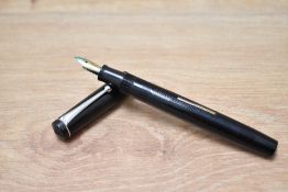 A boxed Stephens 76 lever fill fountain pen in black with single narrow band to cap having Warranted