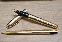 A boxed Sheaffer Imperial 727 converter fill fountain pen and propelling pencil set in gold fill