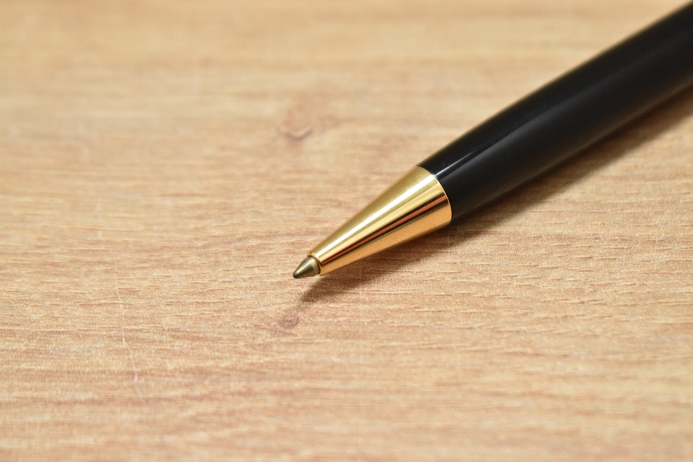 A Montblanc Meisterstuck Classique ballpoint pen in black with gold trim - Image 2 of 2
