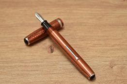 An Esterbrook lever fill fountain pen in copper having an Esterbrook 9284 nib.