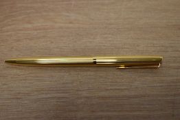 An Aurora 98 22ct rolled gold ballpoint pen in Milleraies Guilloche finish