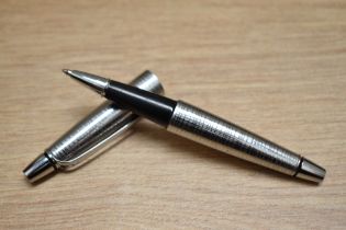 A Cross Stubby chrome rollerball pen.