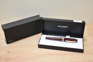A platinum 3776 Century burgundy converter fill fountain pen in original box.