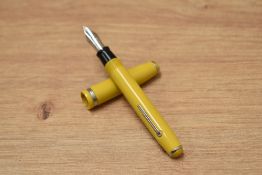 An Esterbrook lever fill purse pen in aloha gold having 9668 Esterbrook nib. Crack to cap.