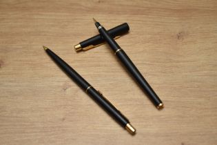 A boxed Parker 180 aero fill fountain pen and ballpoint pen set in matt black with gold trim