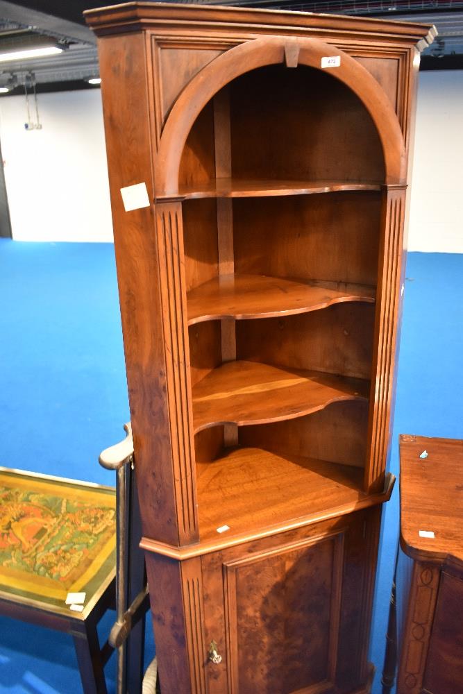 A reproduction corner shelf with cupboard to base, height approx 182cm
