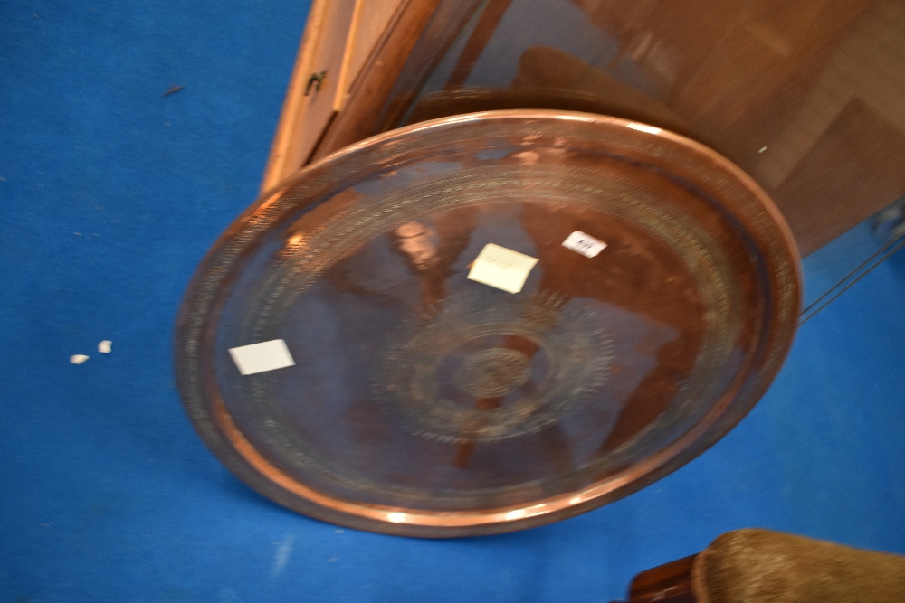 A copper tray or table top, diameter approx. 64cm