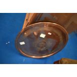 A copper tray or table top, diameter approx. 64cm