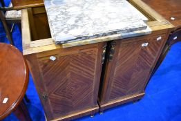 A pair of reproduction continental style bedside cabinets having marble tops