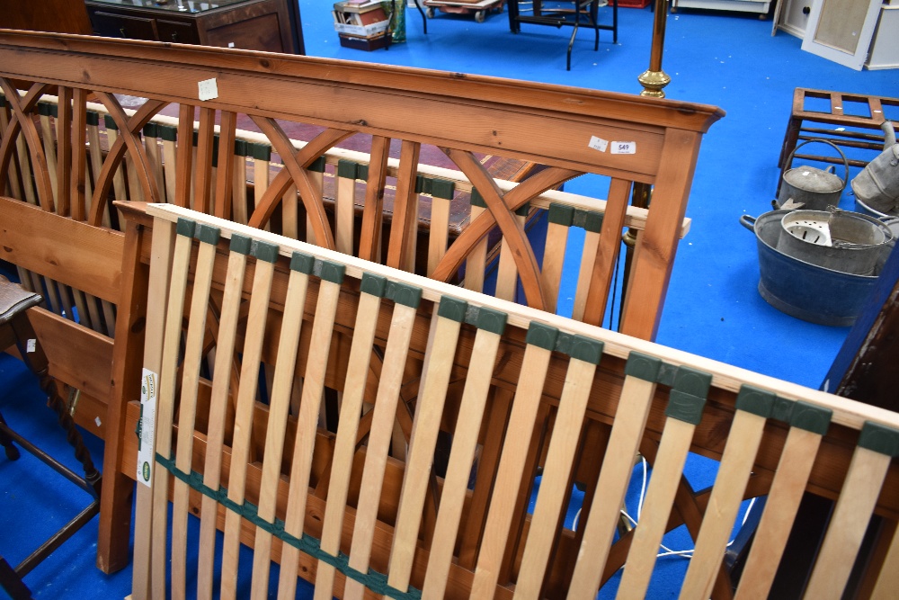 A traditional pine king size bed frame, width approx 194cm