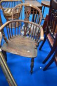 A traditional Windsor armchair having low back