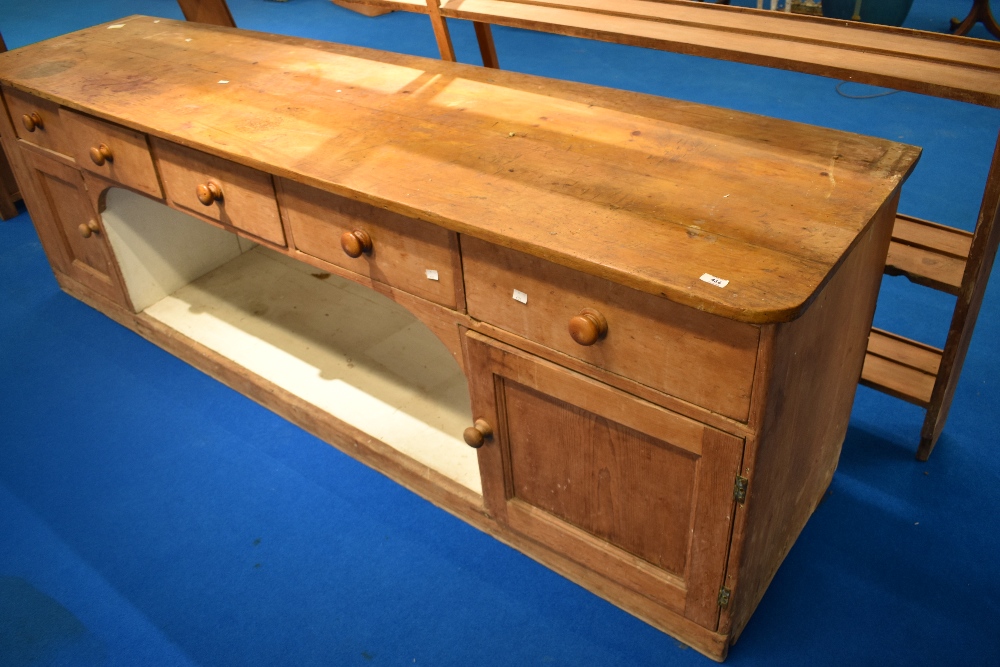 A 19th Century pine dresser having open delft rack , recess to lower section flanked by cupboards - Image 2 of 2