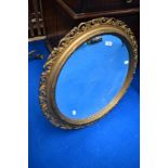 A traditional gilt frame wall mirror of circular form, diameter approx. 65cm