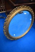 A traditional gilt frame wall mirror of circular form, diameter approx. 65cm