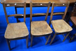 Three traditional solid seat chapel or school chairs