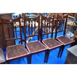 A set of four late Victorian mahognay railback dining chairs with later upholstered seats, Art