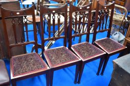 A set of four late Victorian mahognay railback dining chairs with later upholstered seats, Art